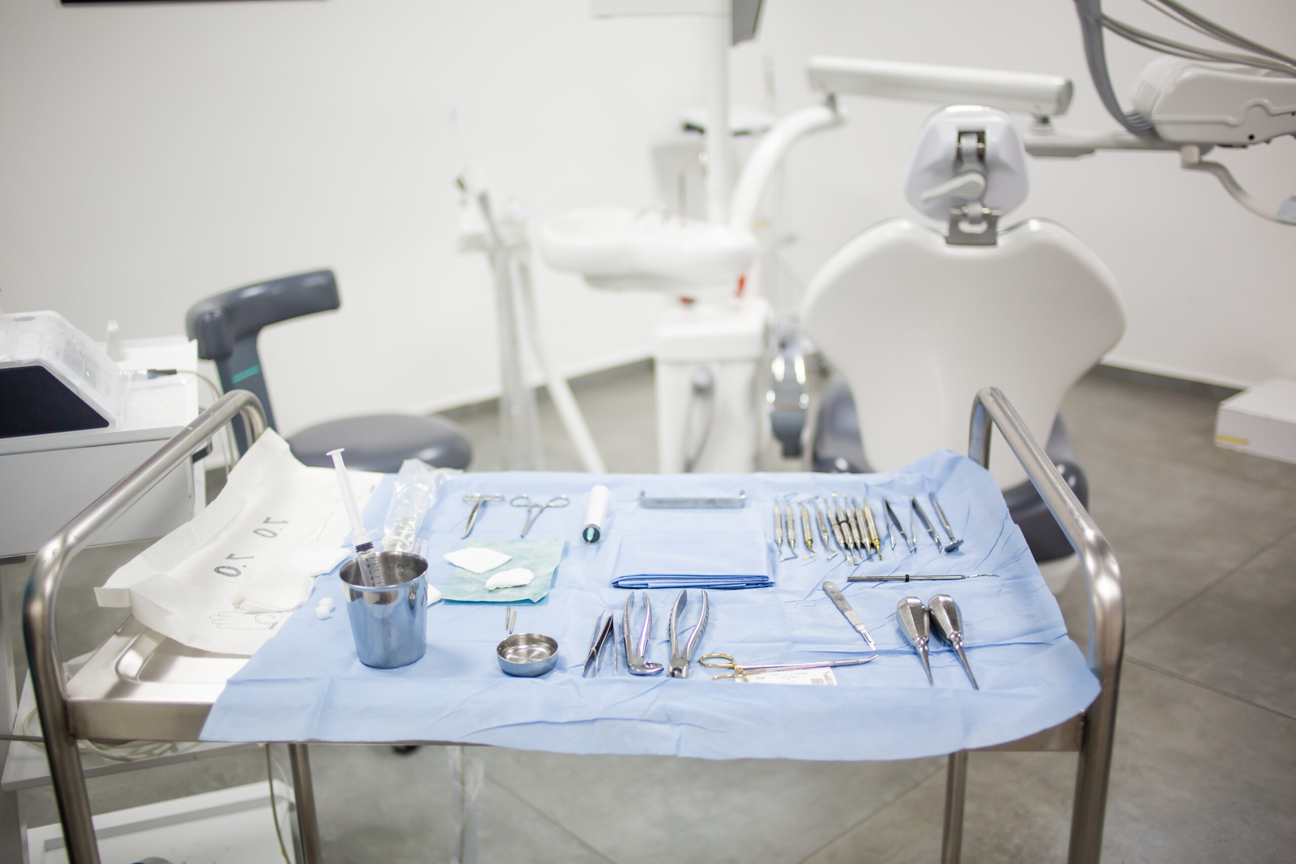Dental Equipment laying on cart inside dental office before surgery.