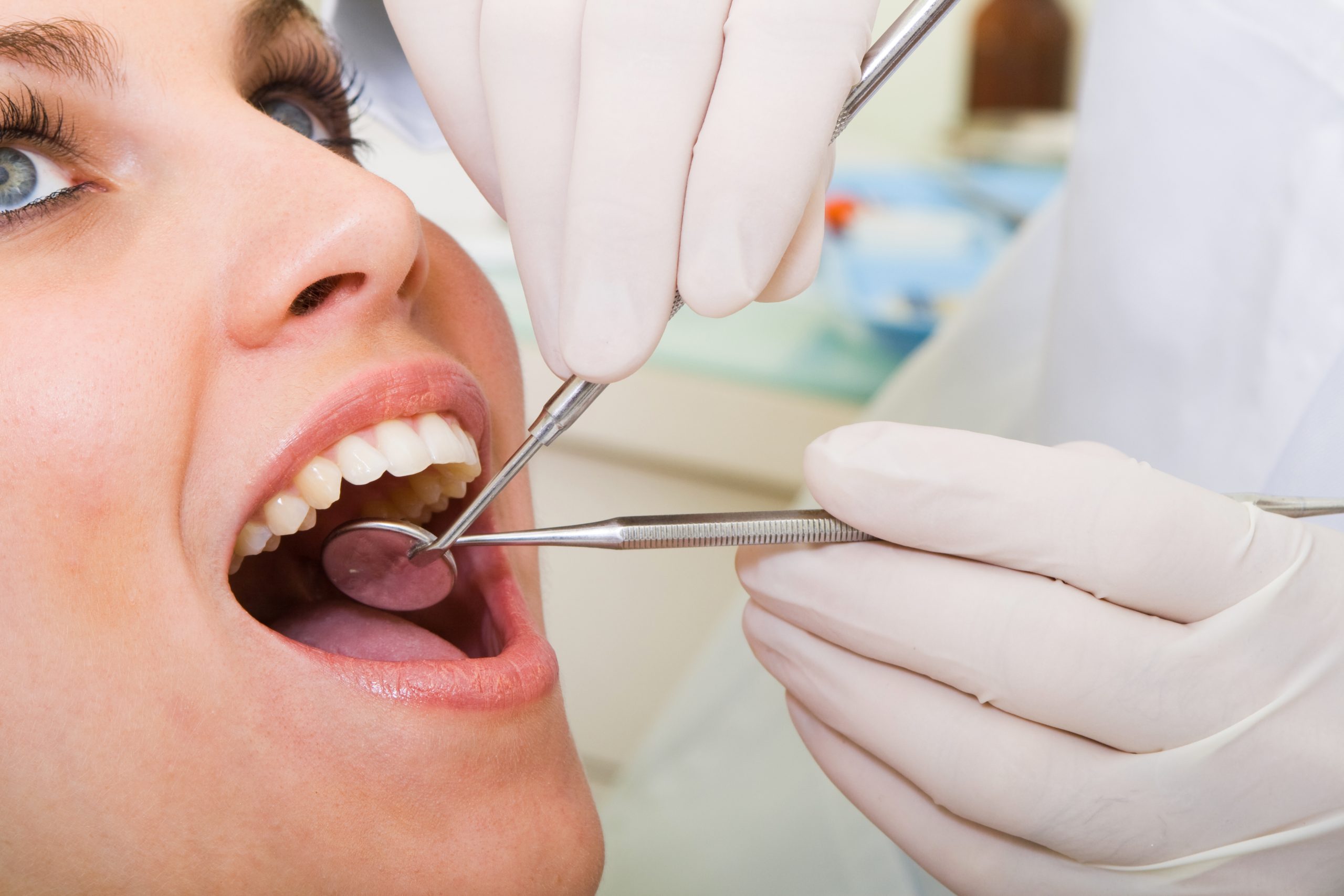 Dentist working on teeth.